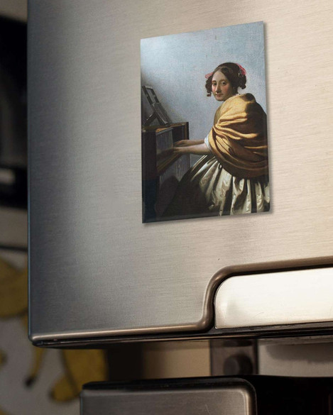 Magnes Młoda kobieta siedząca przy dziedzińcu Jan Vermeer