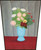 Still life of flowers in a blue vase